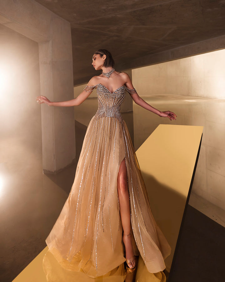Delilah LD11671 Strapless Sunburst Crystal Corset A-Line Gown with Slit - Champagne front view