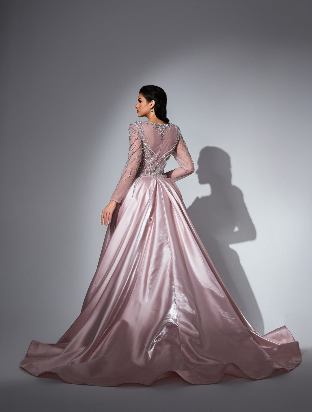 Delilah LD11475 Plunging Illusion Long Sleeve Beaded Corset Sheath Gown with Overskirt - Pink back view