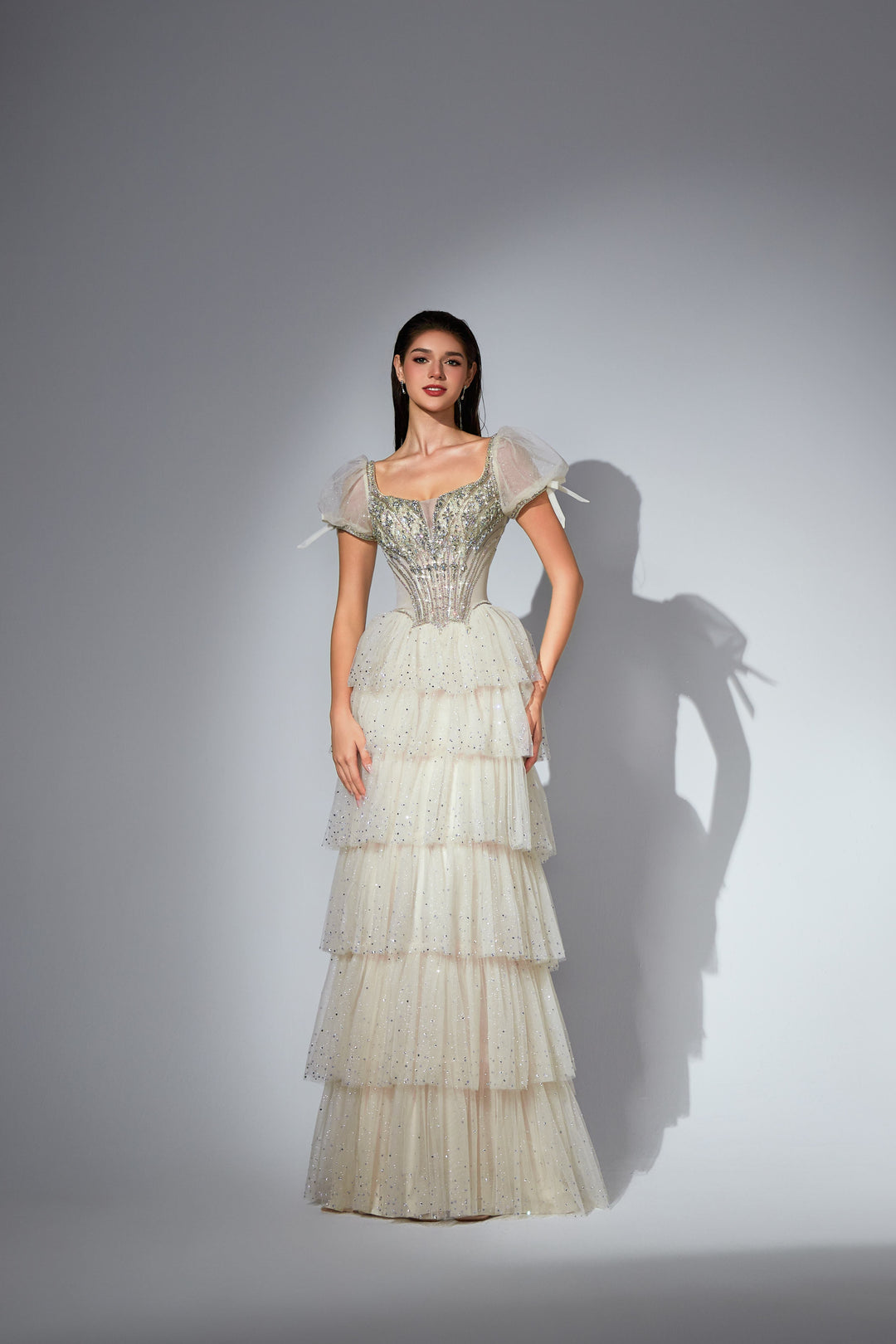Delilah SH11607 Beaded Corset Gown with Puff Sleeves and Tiered Ruffle Skirt - White front view
